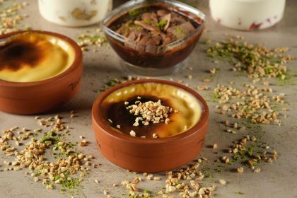 Delicious traditional Turkish sütlaç topped with nuts, perfect for dessert lovers.